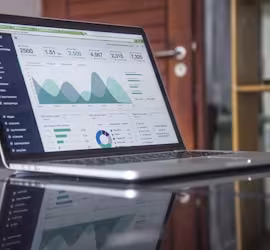 laptop with charts on screen 